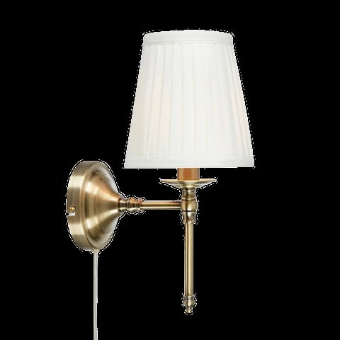 Brass wall sconce with cream pleated linen shade and adjustable arm on black background