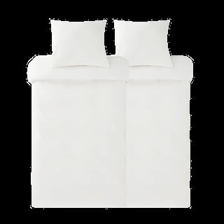 Top-down view of a white bed with pillows and folded duvet set against a black background