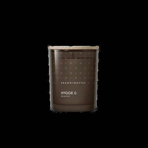 Brown Scandi Navisk Hygge scented candle in a jar against a black background