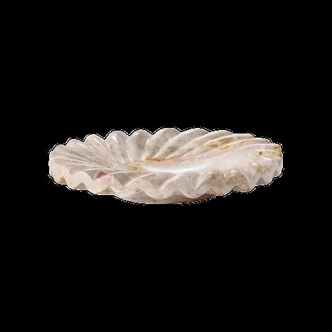 Open oyster shell with white and beige pearl interior against black background