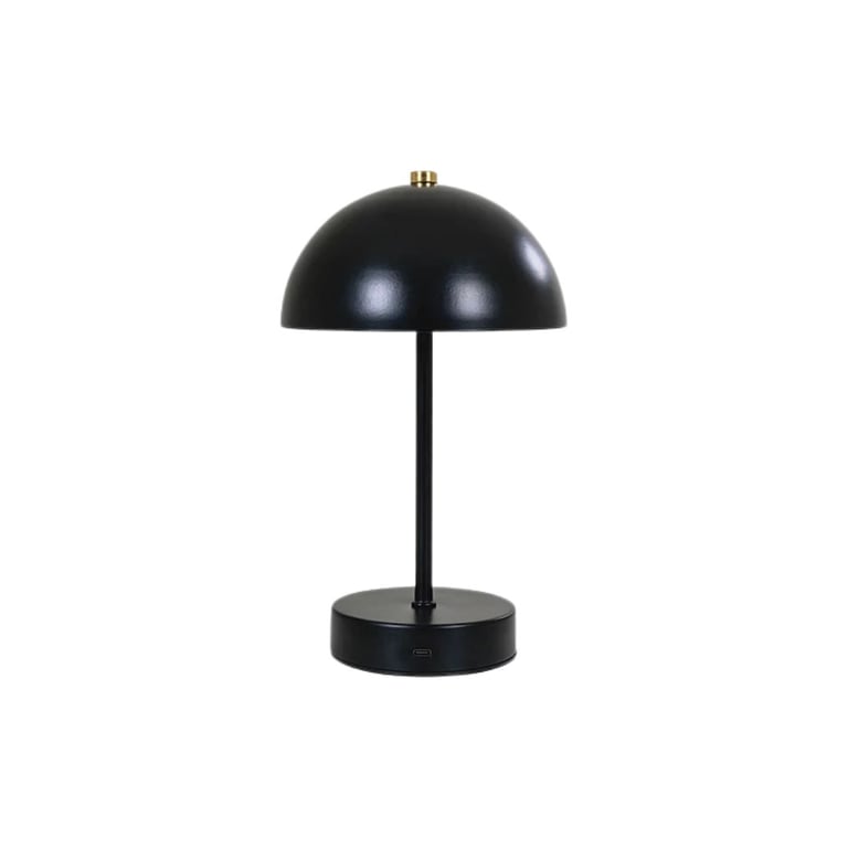 Black dome table lamp with brass accents and round base on white background