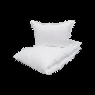 White bedding set with pillow and folded comforter or duvet on black background