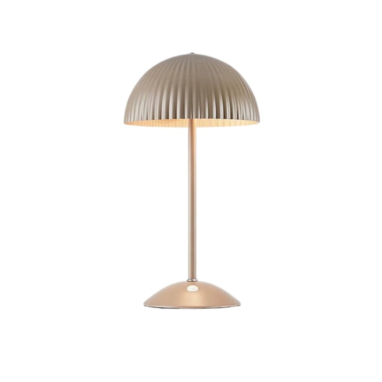 Modern mushroom-shaped table lamp with ribbed metal dome shade and rose gold base on white background