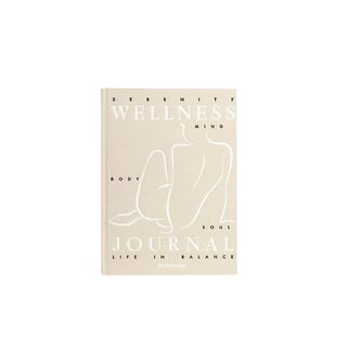 Wellness journal book with beige cover featuring minimalist line drawings and text about mind, body, and soul balance