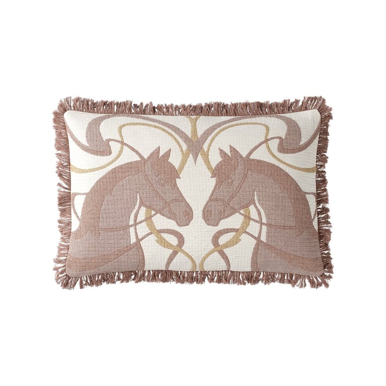 Rectangular decorative pillow with mirrored horse head design in mauve and cream, featuring fringe trim